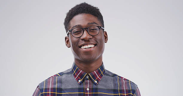 istock Portrait, nerd and black man in studio as student for scholarship, learning or college education. Smile, learner and geek with glasses for university with happiness on white background space 2228811628