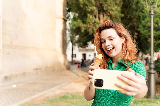 istock Tourist taking a selfie while enjoying an ice cream 2228811873