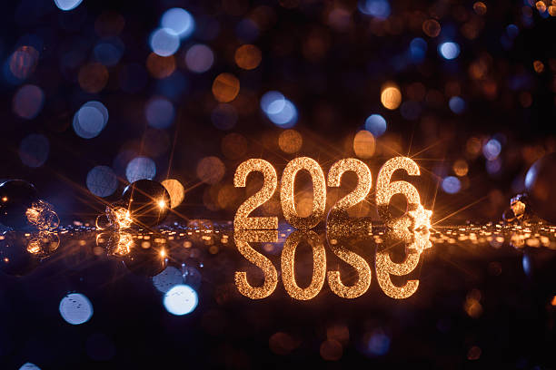 Glittering 2026 Numbers Reflected on Glossy Surface with Festive Lights