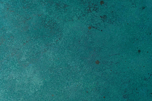 istock Textured teal wall with subtle paint speckles and aged effect 2228815878