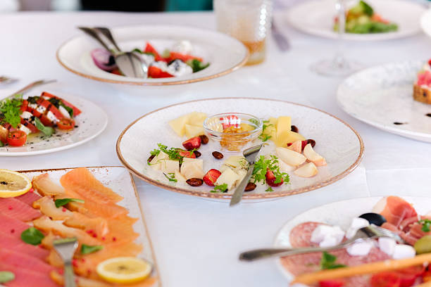 Delicious assortment of appetizers served on stylish plates at a lunch gathering.