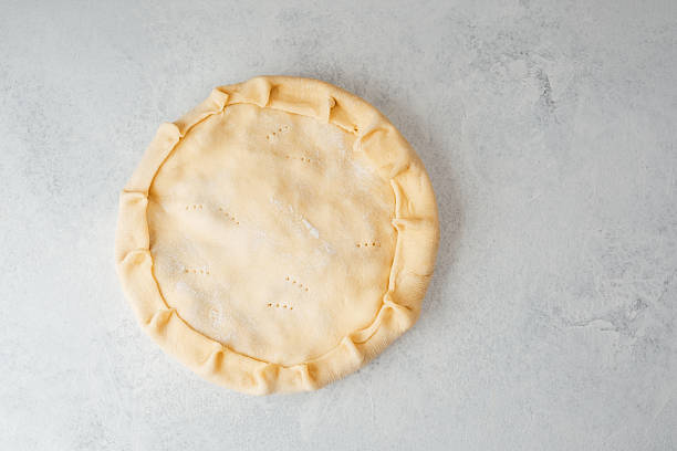 istock Homemade pie crust preparation on a marble countertop in the kitchen 2228817074