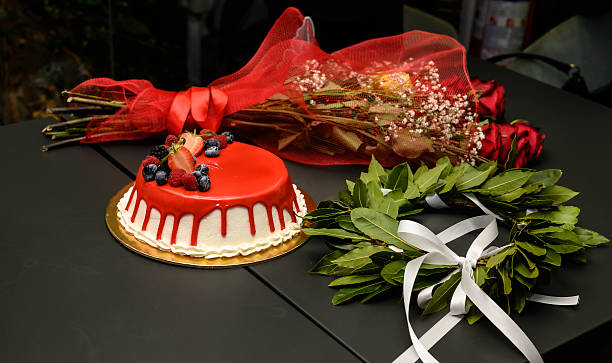 istock laurel wreath with flowers and graduation cake 2228819092