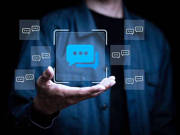 istock A person is holding a screen with a blue square that has a bunch of speech bubbl 2228821119