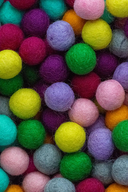 istock Colorful felt wool balls background, full frame 2228824848