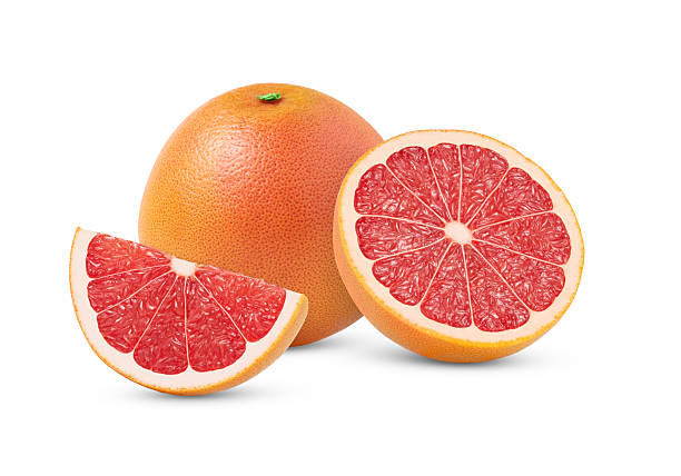 istock Juicy grapefruit and with a half isolated. Halved grapefruits. Whole grapefruit and grapefruit cut with clipping path.. 2228825253