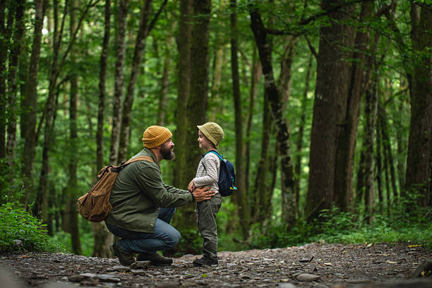 istock Father and Son Bonding During a Nature Hike in a Lush Forest 2228830394