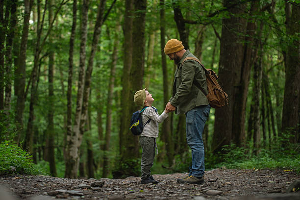 istock Father and Child Bonding Together in a Serene Forest Landscape 2228830456