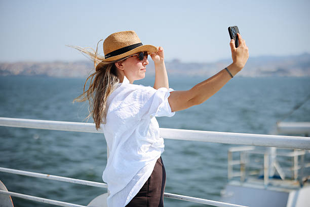 istock Young woman using smart phone on vacations 2228830594