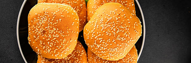 Grilled hamburger buns on white dish