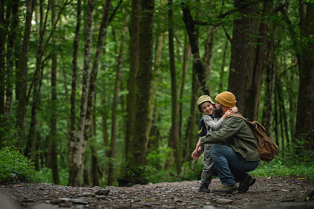 Parent and Child Enjoying Nature in a Serene Forest Setting