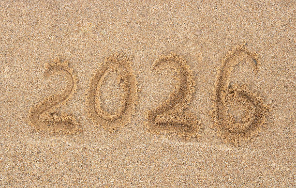 istock On wet river sand, a New Year's 2026 greeting written on a sandy beach. 2228840931