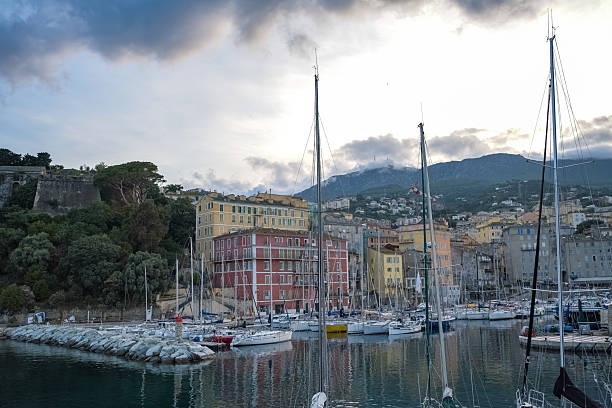 Corsica, Bastia, typical houses in the harbor in summer, sunset