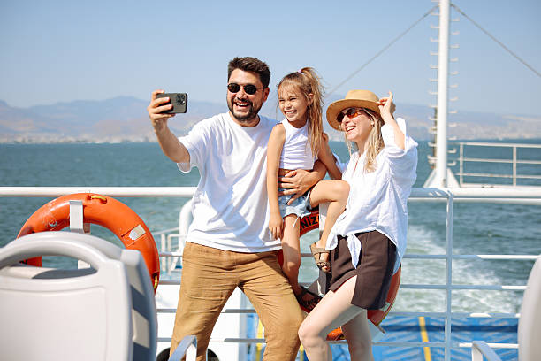 Father and mother with Enjoy on the Ferry Boat Deck in Sunny Day Traveling on Vacation