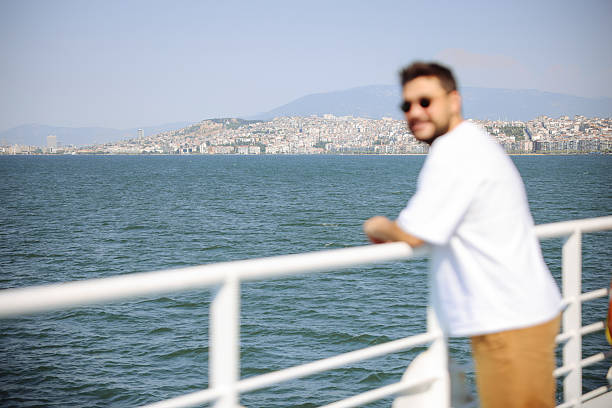istock Man traveling on ferry through Bosphorus in Izmir 2228842774