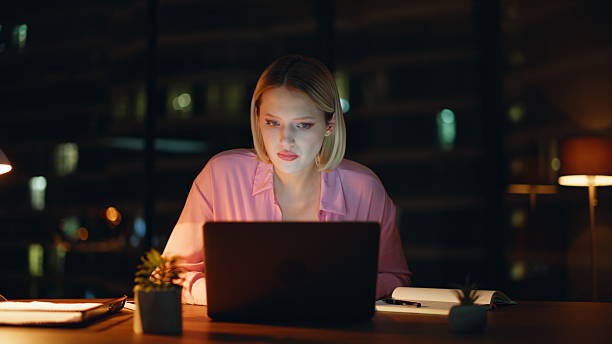 istock Stressed worker reading laptop at night workplace closeup. Woman frustrated 2228843065