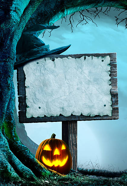 istock Old Weathered Sign In A Spooky Forest On Halloween Night 2228844262