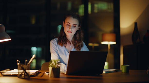 istock Overtime worker disappointed mistake looking computer in lamp light closeup. 2228844416