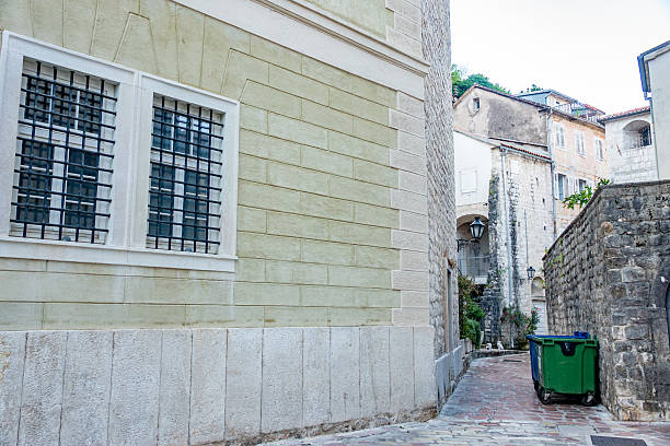 The Austrian (Austro-Hungarian) Prison—locally known as the “Old Prison” or the “Yellow House”—is a mid-19th-century, three-storey stone-and-brick structure in Kotor’s medieval Old Town, designed by Dalmatian architect Marko Bencon and identifiable by its yellow facade and wrought-iron grilles. Throughout its 150-year history, it housed convicts and, during World War II, served as a collection point for civilians deported by Italian occupiers. After ceasing operations in the early 1990s, the Ministry of Culture spearheaded a restoration (2020–2021), converting it into a museum and creative centre featuring artist residencies and exhibitions.