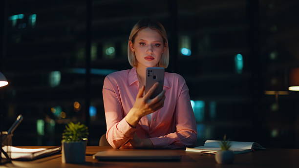 istock Manager reading sms dark office workspace closeup. Confident businesswoman 2228844508