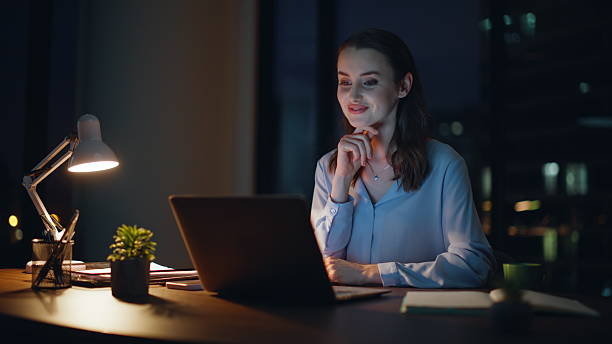 istock Positive employee talking virtual conference in night office smiling closeup. 2228844551