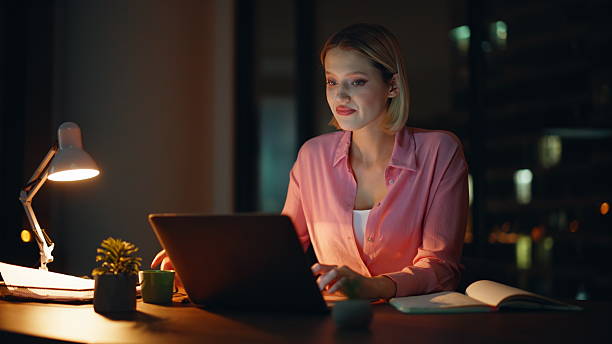 istock Lady freelancer working night apartment in lamp light drinking coffee closeup. 2228845822