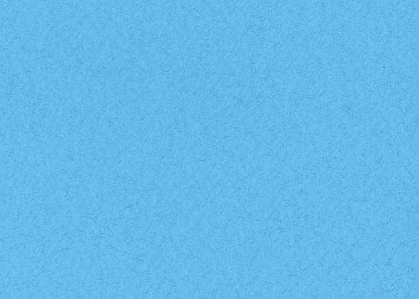 Recycled light blue paper with textured surface and natural fibers. Ideal for eco design, backgrounds or stationery.