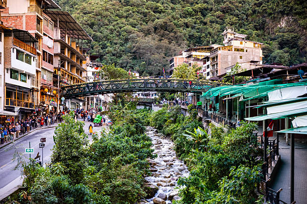 Pueb Machu Picchu, Peru - July 05, 2025: Urubamba River passing through Pueb Machu Picchu or Aguas Calientes, Peru.