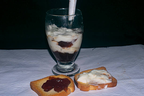 Strawberry marmalade and yogurt on the table