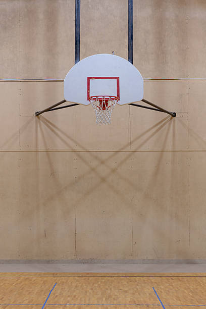 istock Basketball goal in an old gym 2228856511