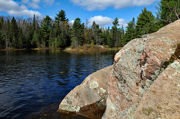The rocky shoreline of Peck Lake is seen from a hiking trail in Ontario's Algonquin Provincial Park.