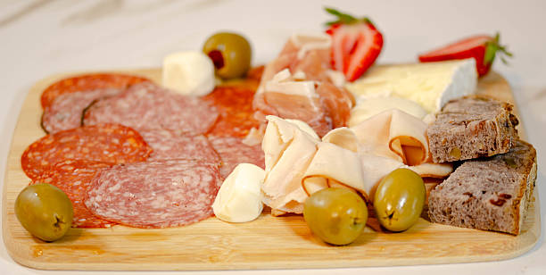 istock Savory Platter with Ham, Prosciutto, Cheese, and Olives 2228860893