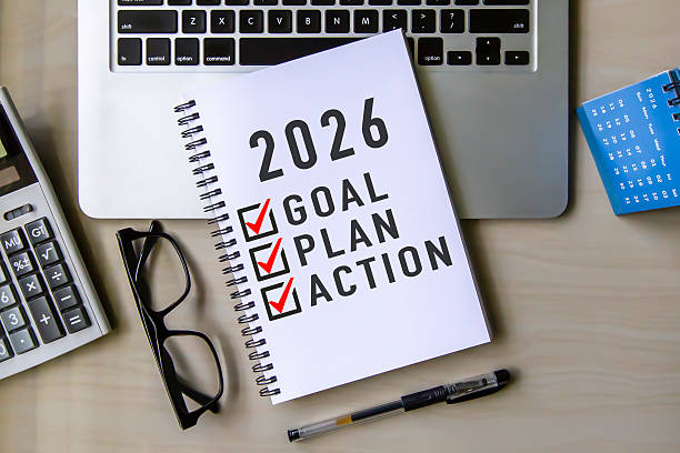 istock 2026 Goal, Plan, Action checklist text on note pad with laptop, glasses and pen. 2228861272