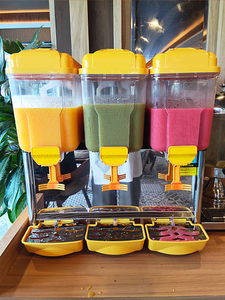 istock Colorful Tropical Juice Dispensers at Refreshment Station 2228863399