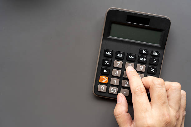 istock Hand Using Calculator with Copy Space. Financial Planning Concept. Budget Planning. Financial management, business organization, management, or tax preparation themes. 2228863604