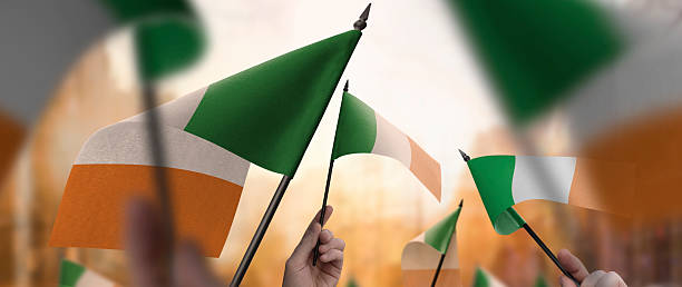 istock Ireland flags in their hands on a blurred urban background 2228866229