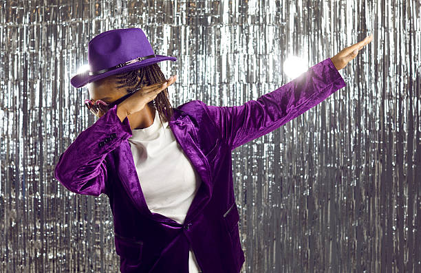 istock Black woman in disco suit dab dancing 2228875877