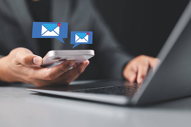 istock Businessman using smartphone with email. Business email communication in the digital age new messages and alerts. Inbox with email Marketing Strategy and Notifications. internet technology. 2228880565