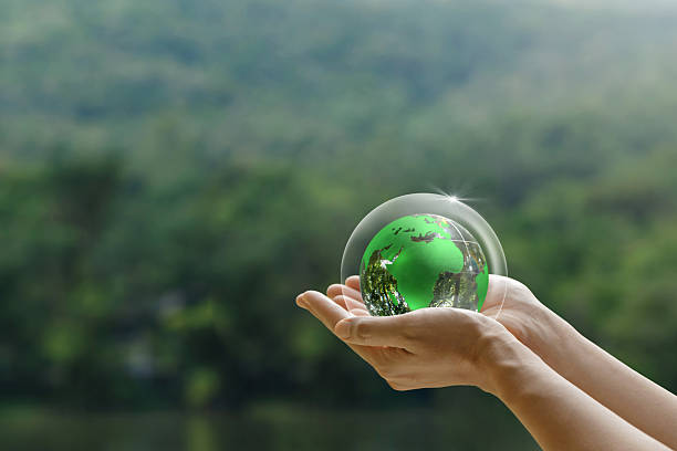 World Ozone Day. A human hand holding a glass globe with a protective layer. environmental and ecological saving. environmental protection, Save the world and the environment, Earth Day .ESG.CSR