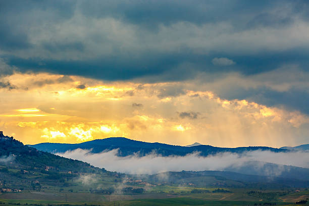 istock Low clouds among the mountains at a sunset 2228882963