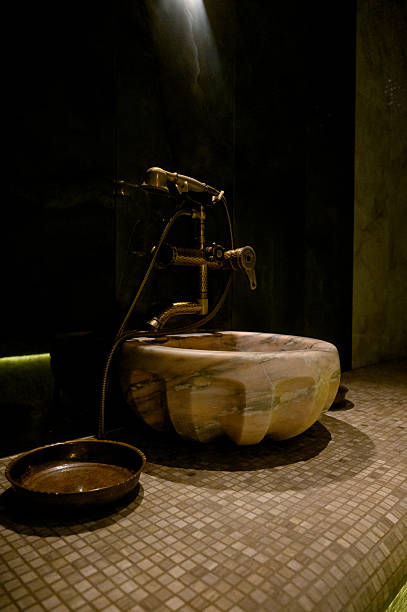 Interior of a hammam sauna with stone finishing and lighting. Spa or sauna relaxation room interior design.