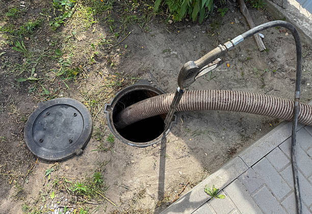 istock A man is working on a sewer line with a hose 2228883994