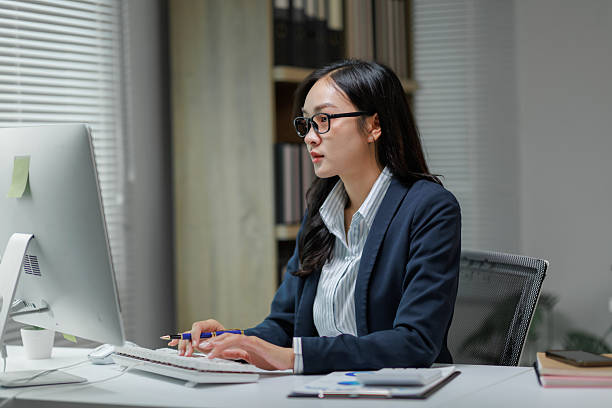 istock Focused businesswoman working at her desk 2228884264