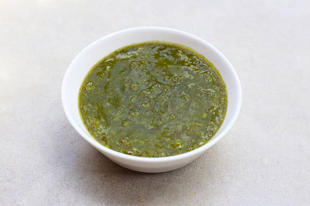 istock Thai green seafood dipping sauce in a small ceramic bowl 2228884463