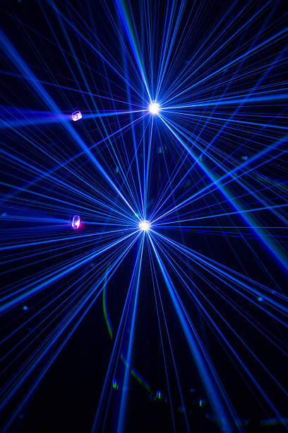 istock Blue and purple beams in dark background. 2228887366