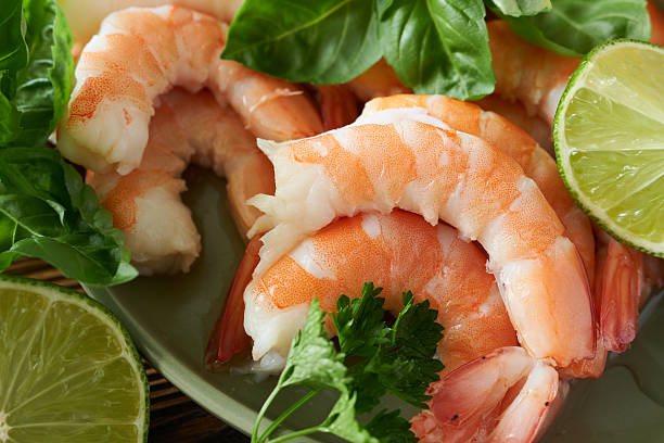 istock Shrimps with lime and parsley on plate, closeup 2228888701