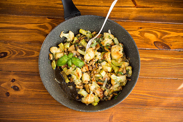 istock Fragrant vegetables with cauliflower in a frying pan 2228891008