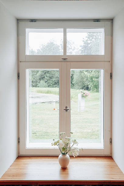 istock Minimalist Window View with White Flower Vase 2228891371