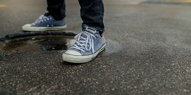 istock Canvas Shoes Wet Street 2228891542