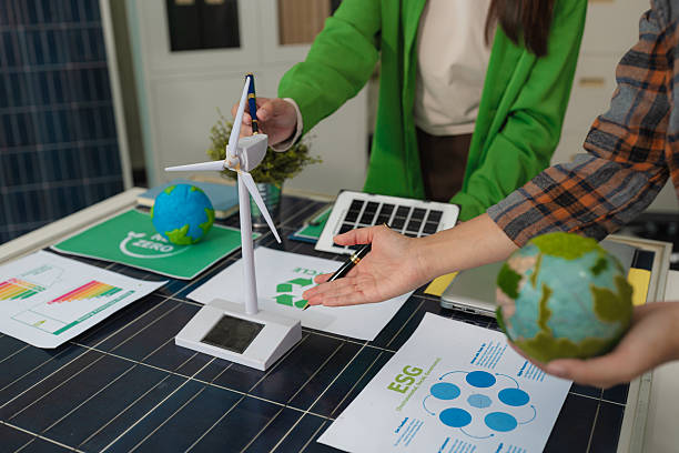 istock colleagues discussing data working and tablet, laptop with on Construction Site project, green energy and solar panel concept. 2228894008